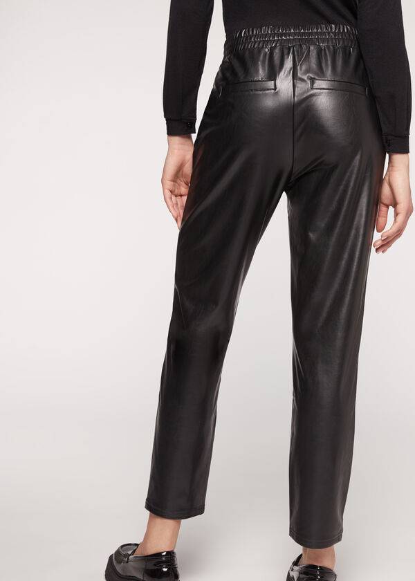 pantaloni neri da donna calzedonia effetto spalmato termico con finiture a catena